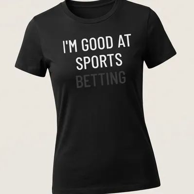 Bold typography t-shirt saying 'I'm Good At Sports Betting' in black on white. — printed on a women's shirt