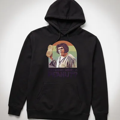 Vintage illustration of a character holding a peanut with playful text. — printed on a unisex hoodie