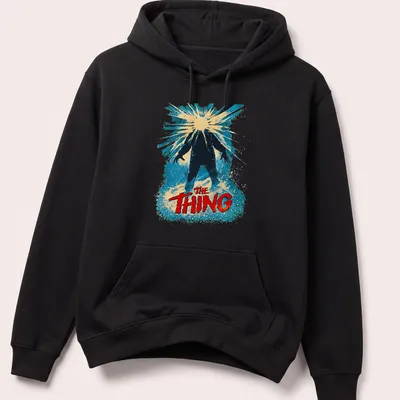 Retro design featuring The Thing title in bold colors and style — printed on a unisex hoodie