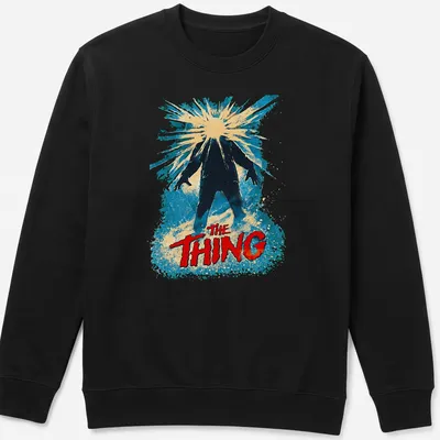 Retro design featuring The Thing title in bold colors and style — printed on a unisex sweatshirt