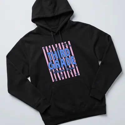 Retro T-shirt with text Third Grade dream team in pink, blue, and white. — printed on a unisex hoodie