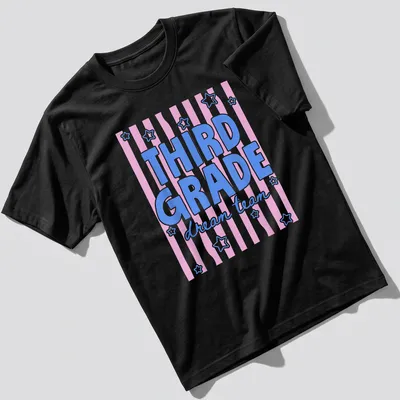 Retro T-shirt with text Third Grade dream team in pink, blue, and white.