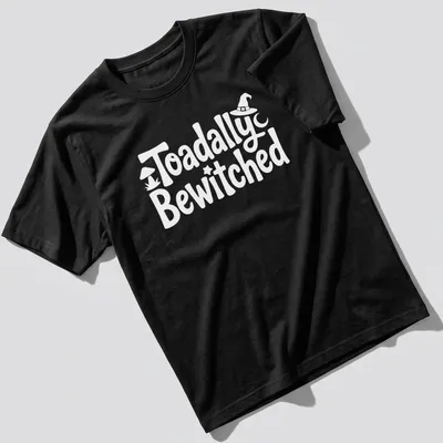 Cartoon toad graphic with playful text 'Toadally Bewitched' in green and black.