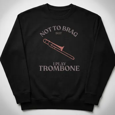 Illustration of a trombone with text: Not to Brag But I Play Trombone in pink, brown, and white — printed on a unisex sweatshirt