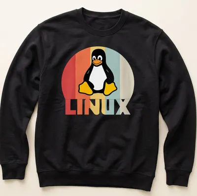 Retro T-shirt featuring the Tux Penguin and LINUX text in playful colors — printed on a unisex sweatshirt