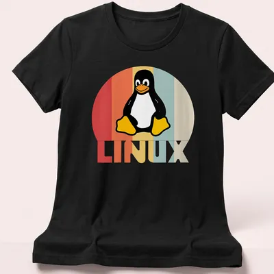 Retro T-shirt featuring the Tux Penguin and LINUX text in playful colors — printed on a women's shirt