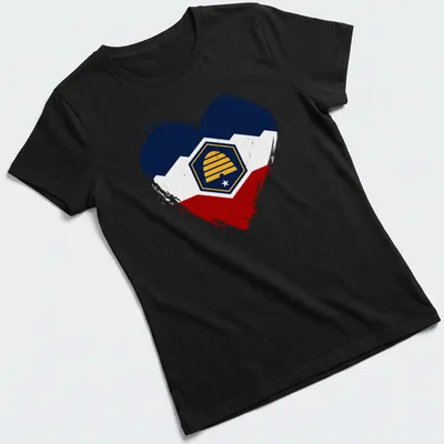 Distressed Utah flag heart with beehive emblem in navy, white, red, and yellow — printed on a women's shirt