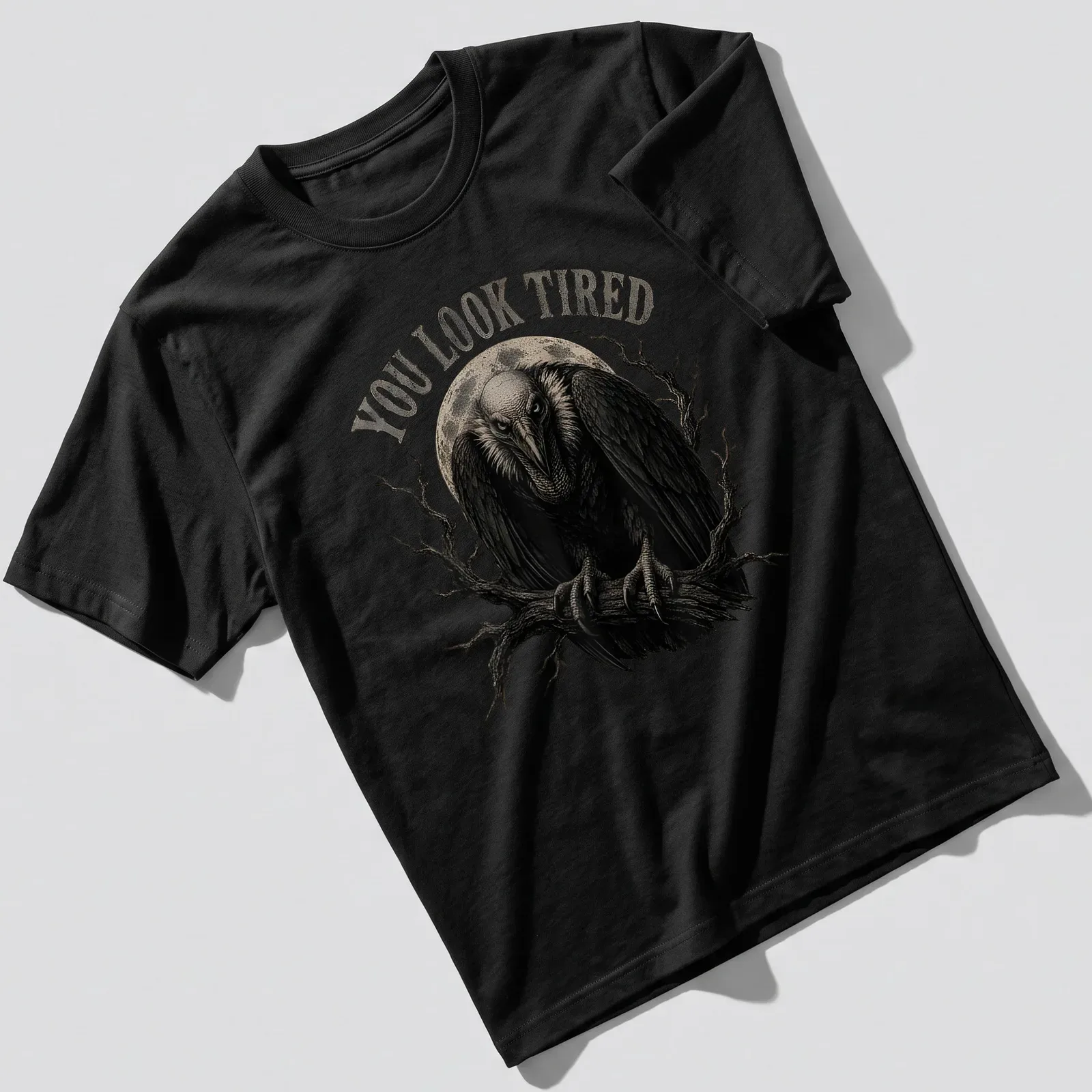 Retro vulture illustration with the text 'YOU LOOK TIRED' in black, gray, and white. — printed on a unisex t-shirt