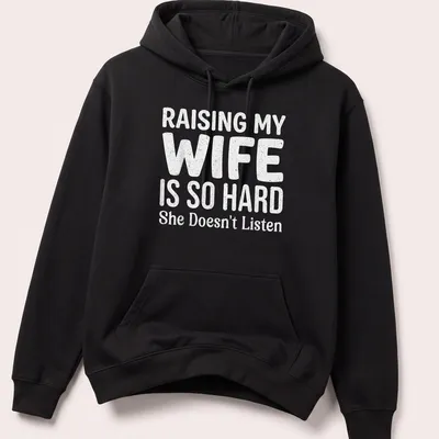 Bold playful typography on a light gray shirt about raising a wife. — printed on a unisex hoodie