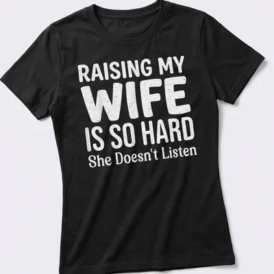 Bold playful typography on a light gray shirt about raising a wife. — printed on a women's shirt