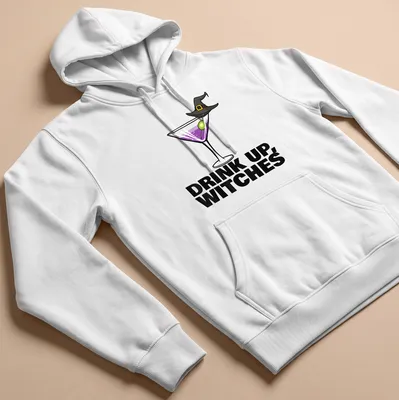 Cartoon design of a cocktail drink with the text Drink Up, Witches in purple and green — printed on a unisex hoodie