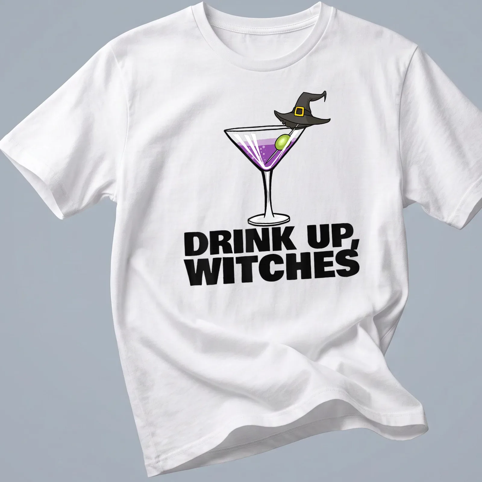 Cartoon design of a cocktail drink with the text Drink Up, Witches in purple and green — printed on a unisex t-shirt
