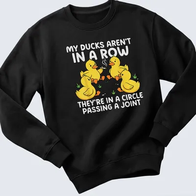 Cartoon design featuring yellow ducks in a circle passing a joint with humorous text — printed on a unisex sweatshirt