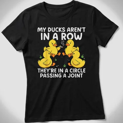 Cartoon design featuring yellow ducks in a circle passing a joint with humorous text — printed on a women's shirt